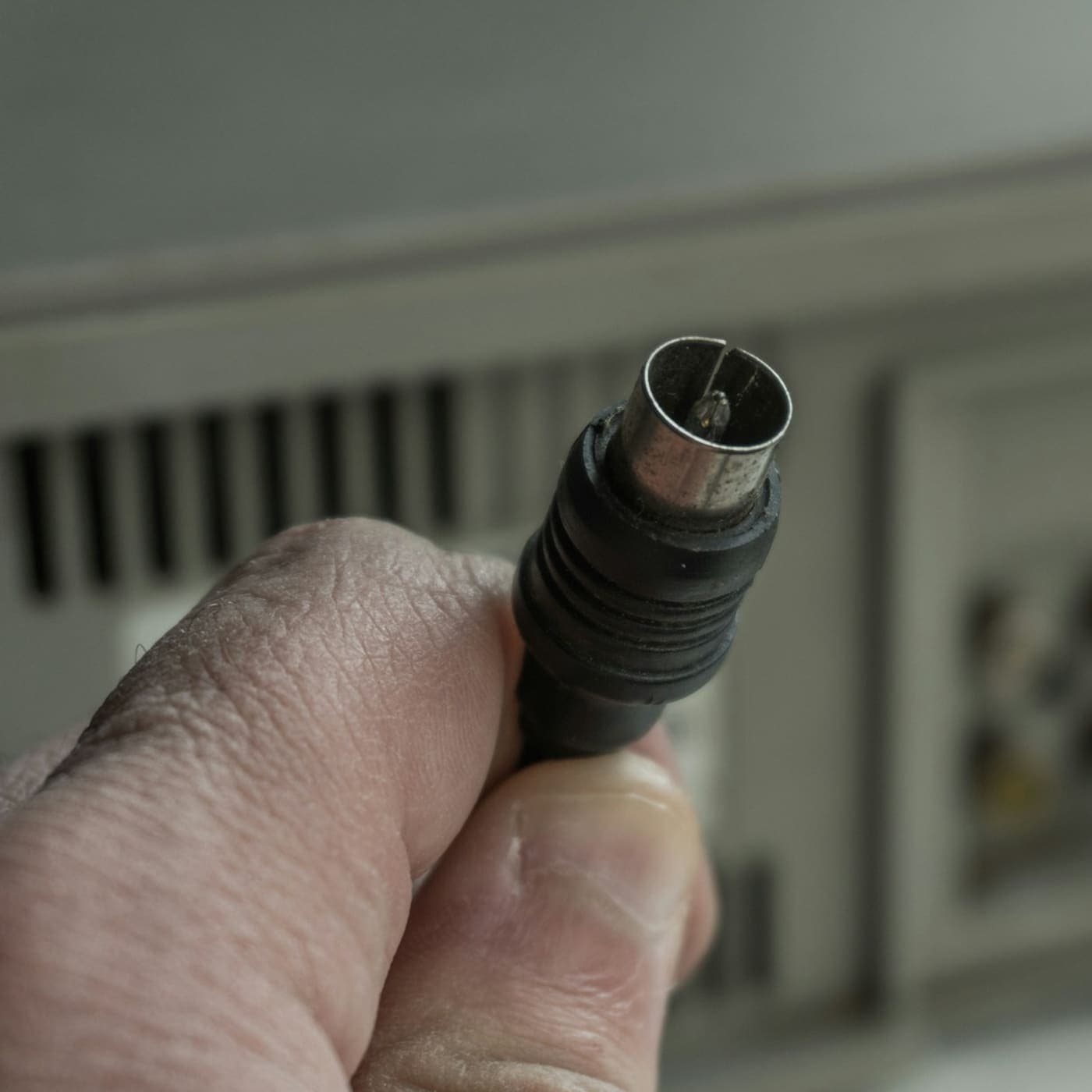 Hand holding an RF connector